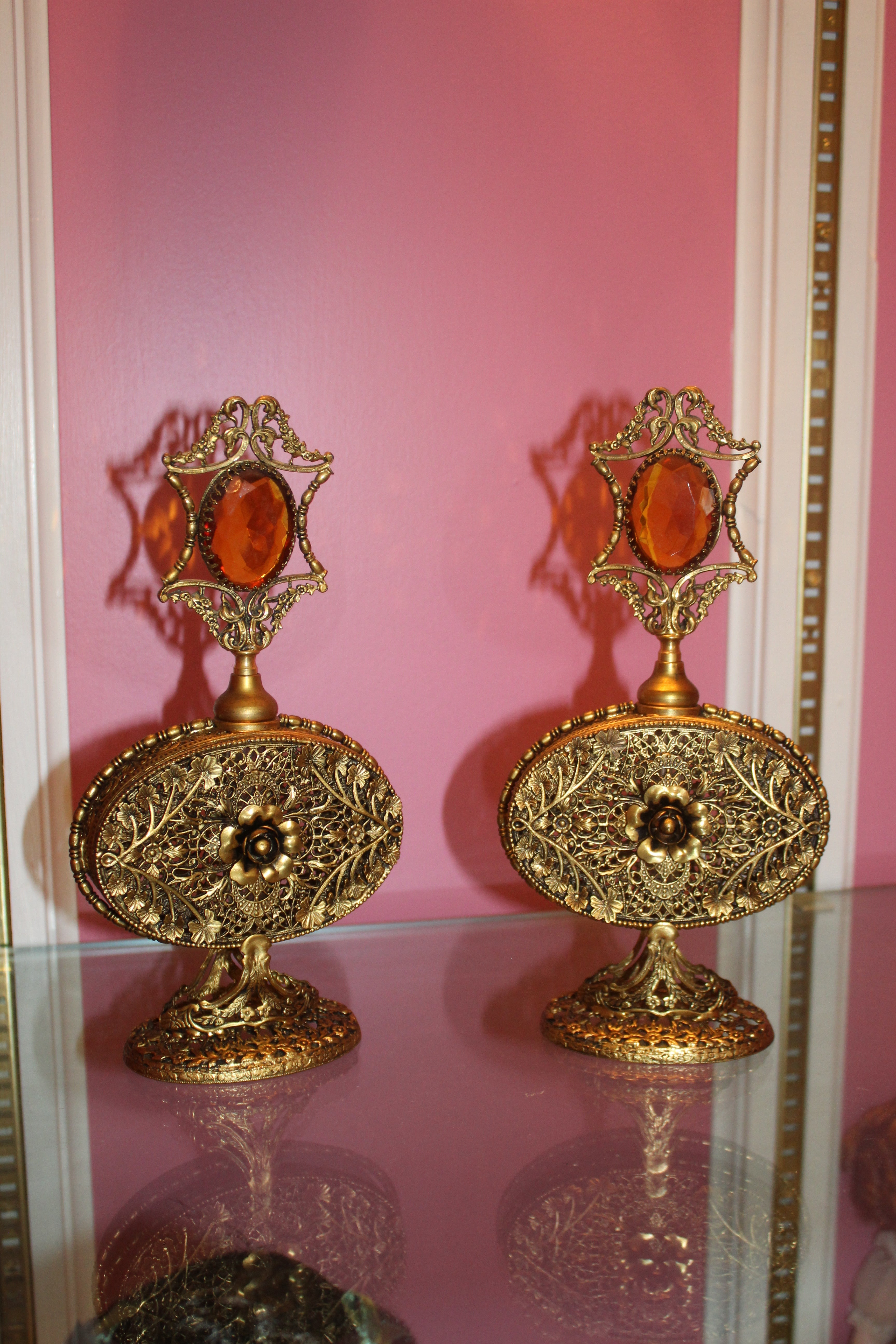 Pair of Vintage Hollywood Regency Ormolu Filigree Perfume Bottles with Amber Glass Accents