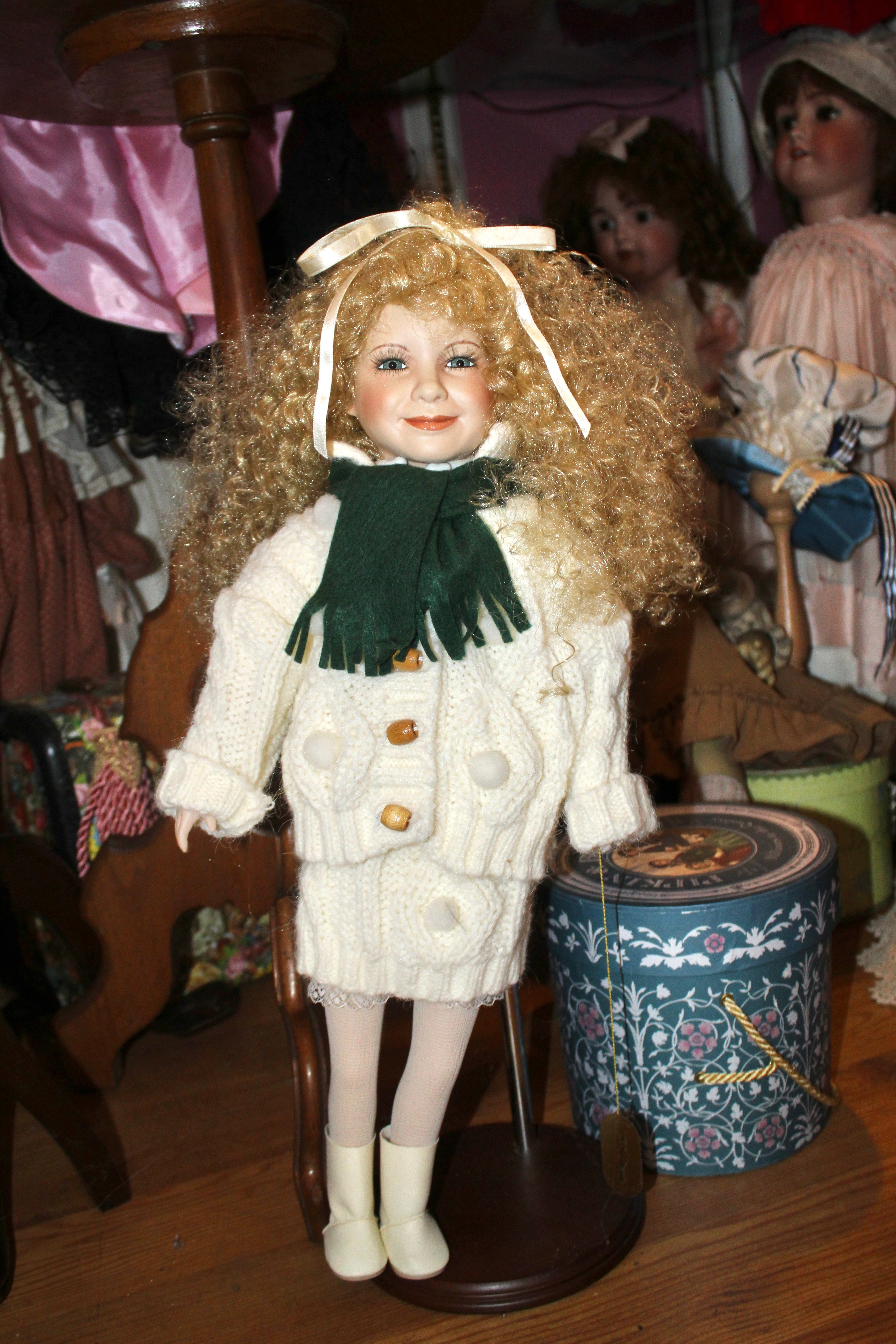 Gretchen M. Wolff “Sydney” Porcelain Collector Doll – Wimbledon Collection | White Knit Sweater Set & Green Scarf | Approx. 18–21”