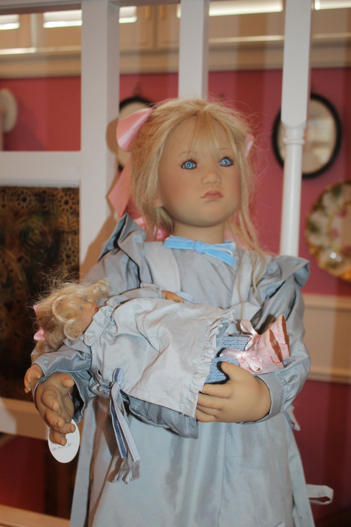 Skille doll from the 2000 collection by artist Annette Himstedt, holding a smaller companion doll named Bibi.