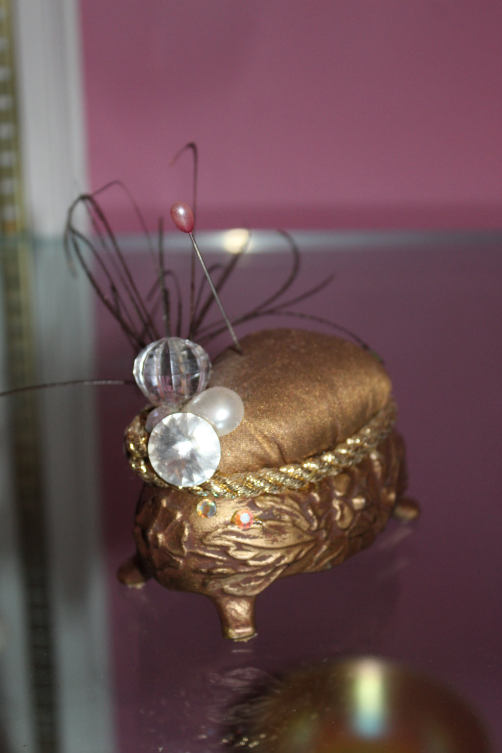 Vintage Gold-Tone Pin Cushion – Ornate Footed Sewing Notion with Feather & Rhinestone Detail