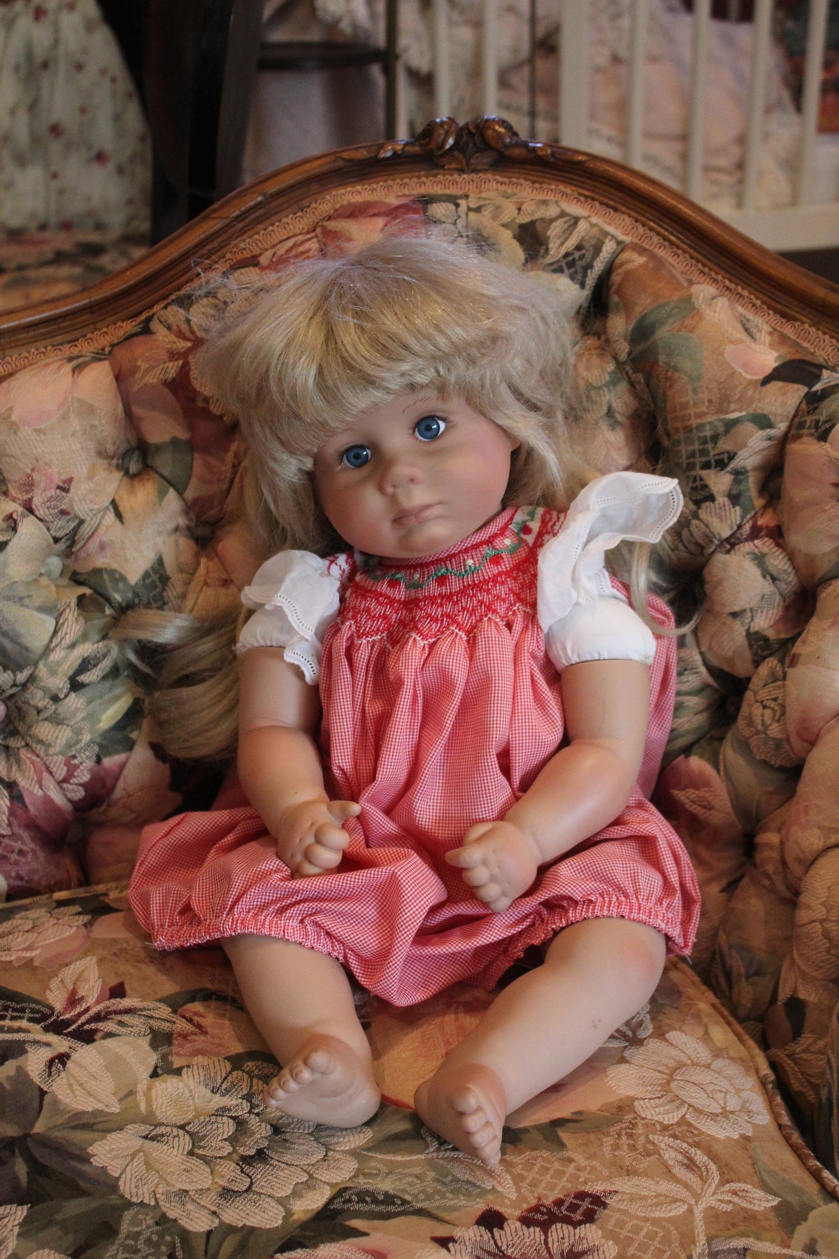 Vintage Blonde Baby Doll in Red Gingham Smocked Dress – Blue Eyes & White Ruffle Sleeves