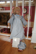 Skille doll from the 2000 collection by artist Annette Himstedt, holding a smaller companion doll named Bibi.